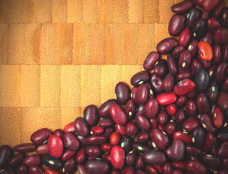 variety of colorful bean on cork background - top view.の写真素材