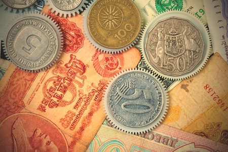 coin gear on the background of banknotes, close-up.  image filter retro style