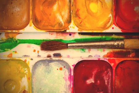 vintage paint-box with brush close up.  image filter retro styleの写真素材