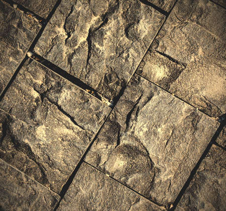 textured surface of a stone on the wall.  image filter retro styleの写真素材