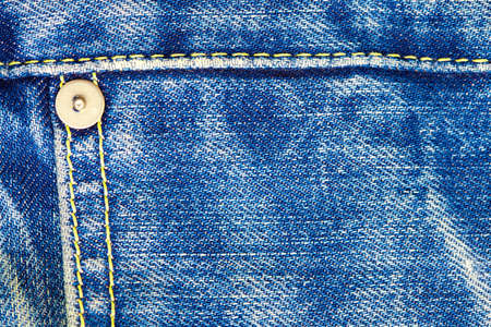 blue jeans background with seams and rivetの写真素材