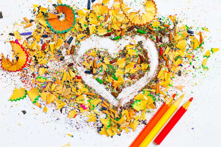heart, three pencils and colored wooden shavingsの写真素材
