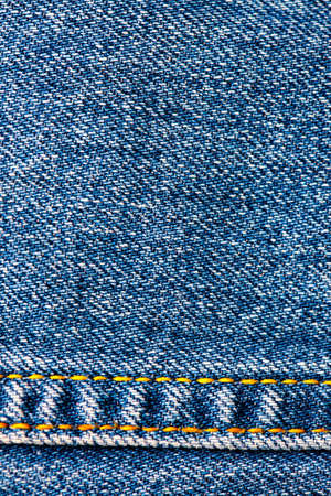 aged jeans background with seams