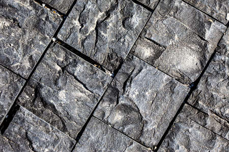 textured surface of a stone on the wall