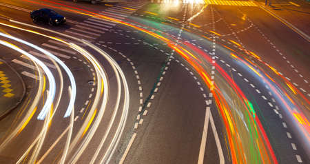 Night crossroads with traces lights of cars. long exposure