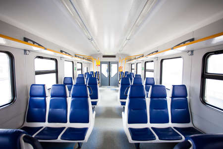 Rows of seats in a passenger railway carriage