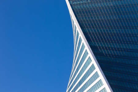 part of office building on blue sky backgroundの写真素材