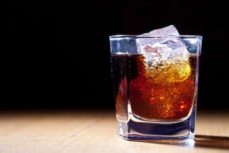 rum and cola in glass with iceの写真素材