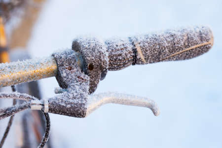 Snowy bicycle wheel with brake lever