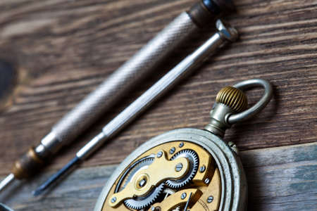 vintage pocket watch on a table watchmaker