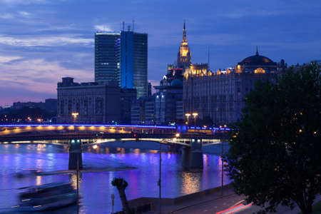 night landscape with Borodino road bridge and Smolensky Metro Bridge in Moscow, Russia. Moscow river and motion ship. long exposure of shutter speedの写真素材