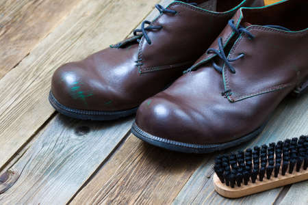 vintage boots, brush and shoe polish.の写真素材