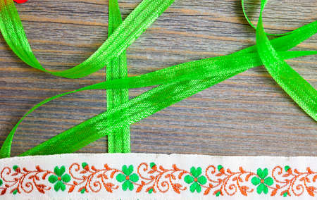 embroidered band and tape on antique textured boardの写真素材