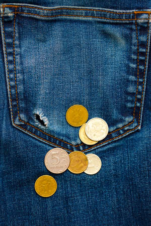 jeans pocket with hole and russian coinsの写真素材