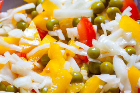 Assorted salad with bell peppers, cabbage, tomatoes and green peas. close upの写真素材