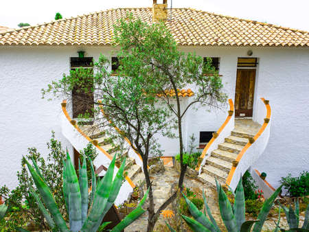 landscape with agave on a background of the house of Mediterranean architectureのeditorial素材