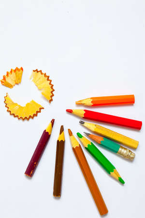 set of a old colored pencils with shavings on the white background. copy space