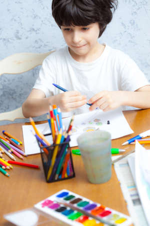 young artist chooses a pencilの写真素材