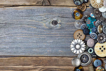 vintage buttons on aged table. close upの写真素材