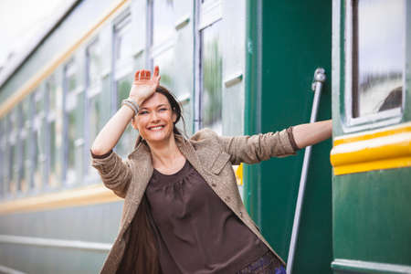 beautiful woman returned from a trip and smiling