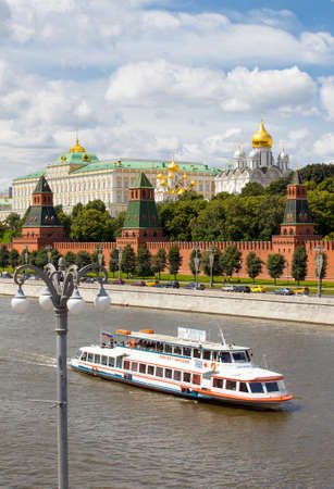 Moscow, Russia, July 8, 2015: Moscow-river, ship and the Grand Kremlin Palace, ancient wall and towers on the Kremlin embankmentのeditorial素材