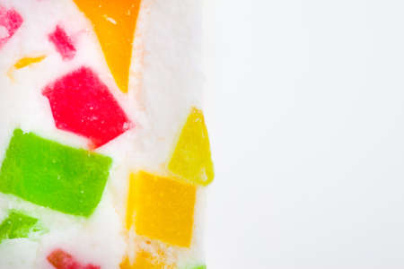 pink candy with fruit slices close-up with copy spaceの写真素材
