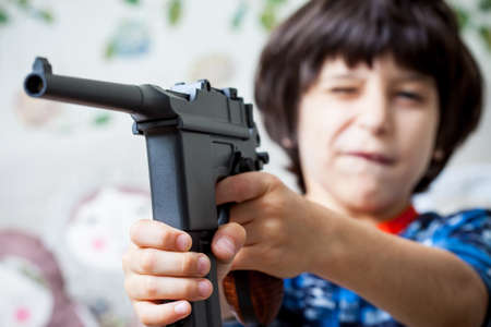 Mauser submachine gun in the hands of the child, close-upの写真素材