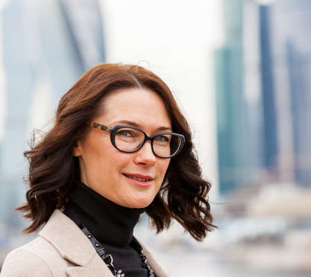 Portrait of a beautiful european middle-aged woman with glassesの写真素材