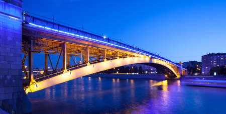 Moscow, Russia, summer evening cityscape with Smolensky Metro Bridge in illumination. Blurred motion, long exposureの写真素材