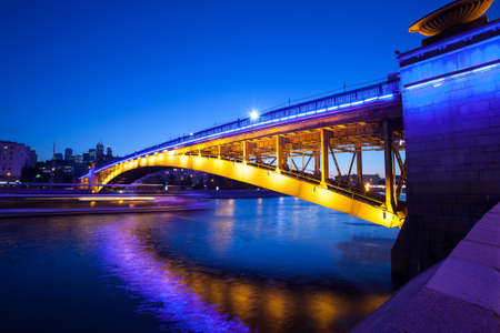 Russia, Moscow Night urban landscape with old Smolensky Metro Bridge. Blurred motion, long exposure