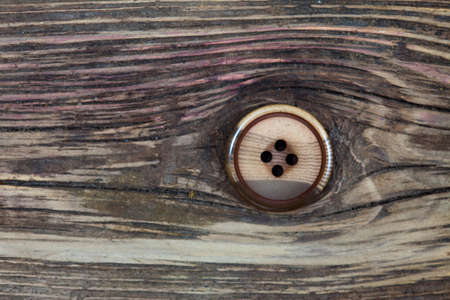 vintage classic button on the old boardsの写真素材