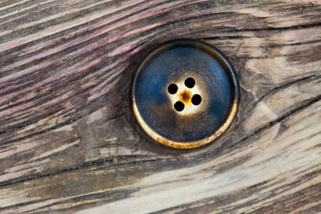 classic vintage button on the old boardsの写真素材