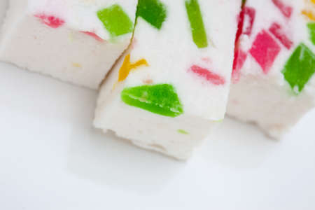 Paste with fruit pieces. delicacy. sweets. abstract background. Shallow depth of field, focus on a piece of fruitの写真素材