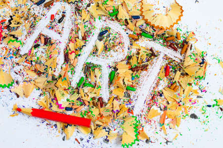 ART word on the background of colored pencil shavingsの写真素材