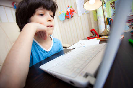 distance learning, a child with computer in the interior