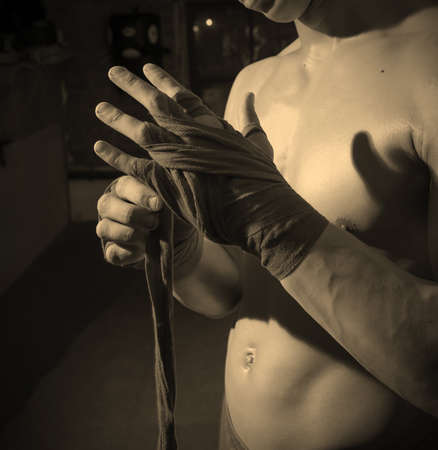 fighter wraps his hands bandages. focus on hands. monochromeの写真素材