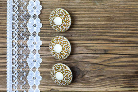 vintage button and lace tape on old wooden surfaceの写真素材