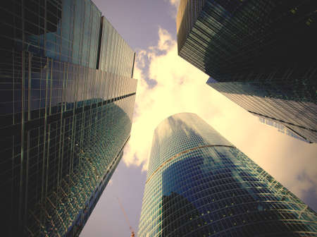 Modern glass silhouettes of skyscrapers on the blue sky background in Moscowのeditorial素材