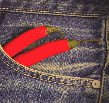 red hot chili peppers in a jeans pocket. instagram image styleの写真素材