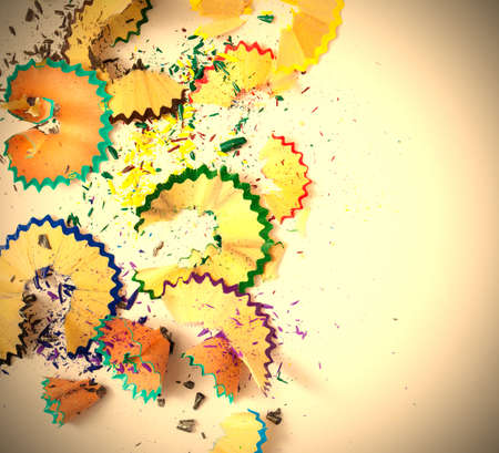 varicolored pencil shavings on white background with copy spaceの写真素材
