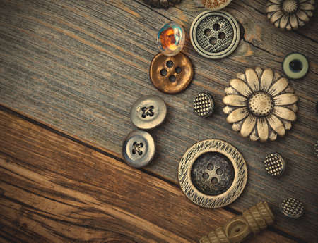 still life with vintage buttons on the aged wooden boards. instagram image retro styleの写真素材