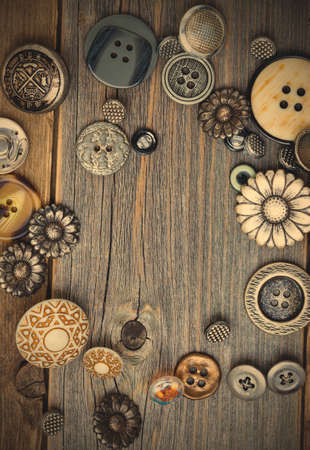 Set of vintage buttons on old wooden boards. instagram image retro style