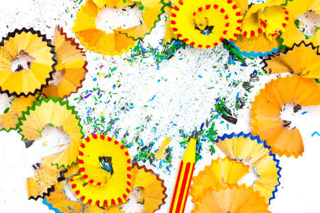 striped pensil on the colored background with  shavings. close up