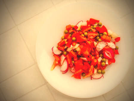 salad of tomatoes, radishes and peas with olive oil. image retro styleの写真素材