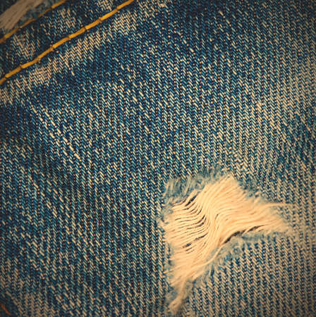 frayed blue jeans background, close up. image styleの写真素材