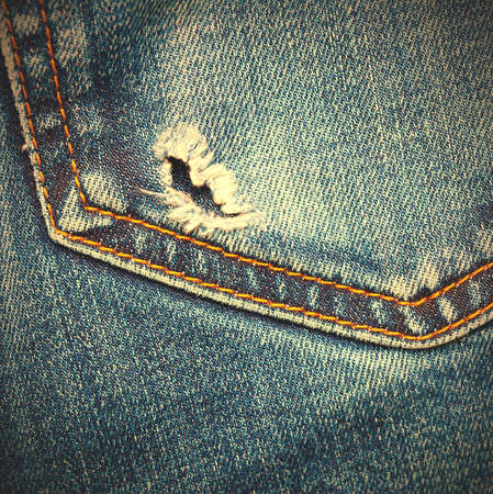 Jeans pocket with hole, close up.の写真素材