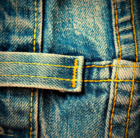 vintage denim surface with seams, close up.の写真素材