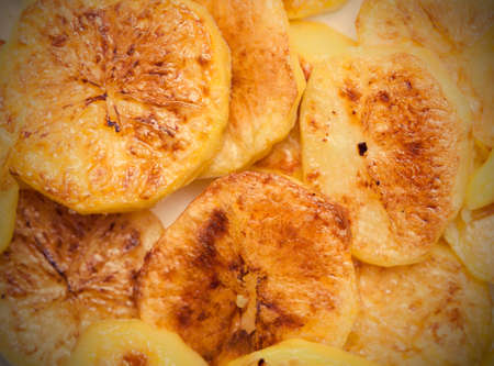 Slices of baked potatoes, close-up.の写真素材