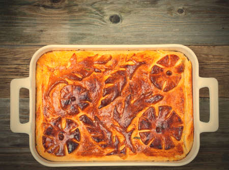 shred-pie in a white ceramic pot on vintage table.