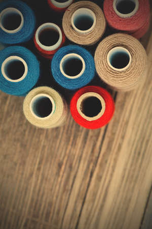 several varicolored spools of thread with copy space. shallow depth of field.の写真素材